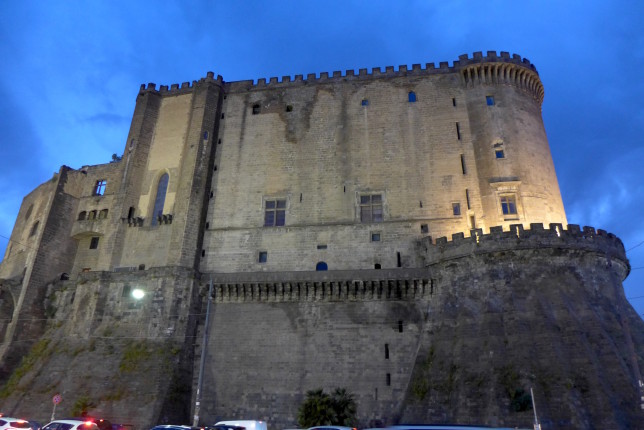 Castle lit up at night.