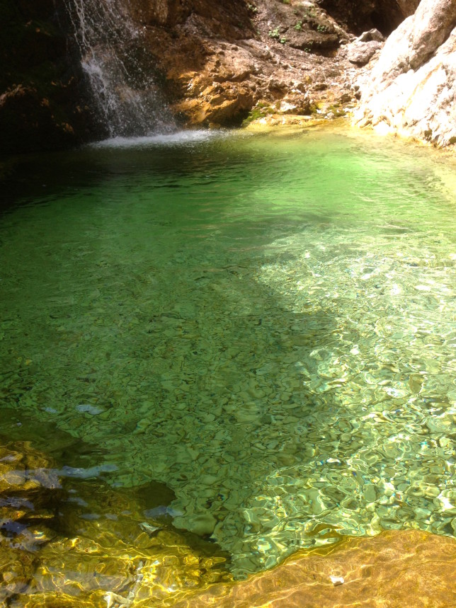 Emerald green, crystal clear water